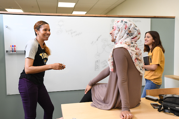 Three students study together in Cook Library